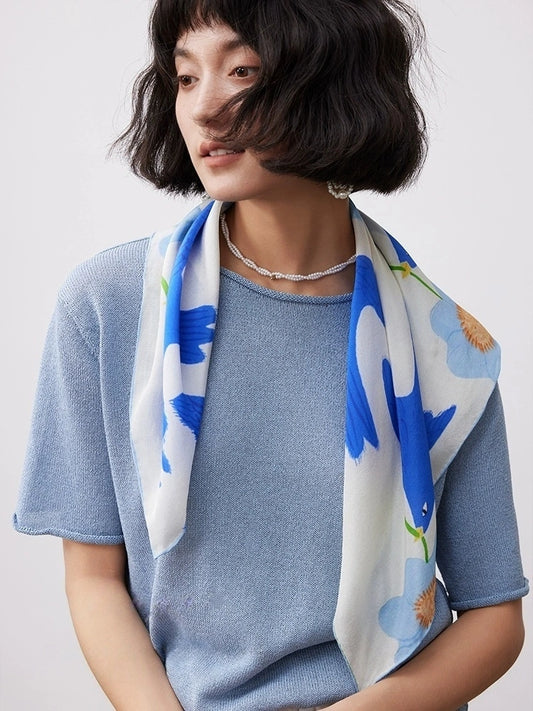 Blue bird flower silk square scarf draped over the shoulders for casual styling