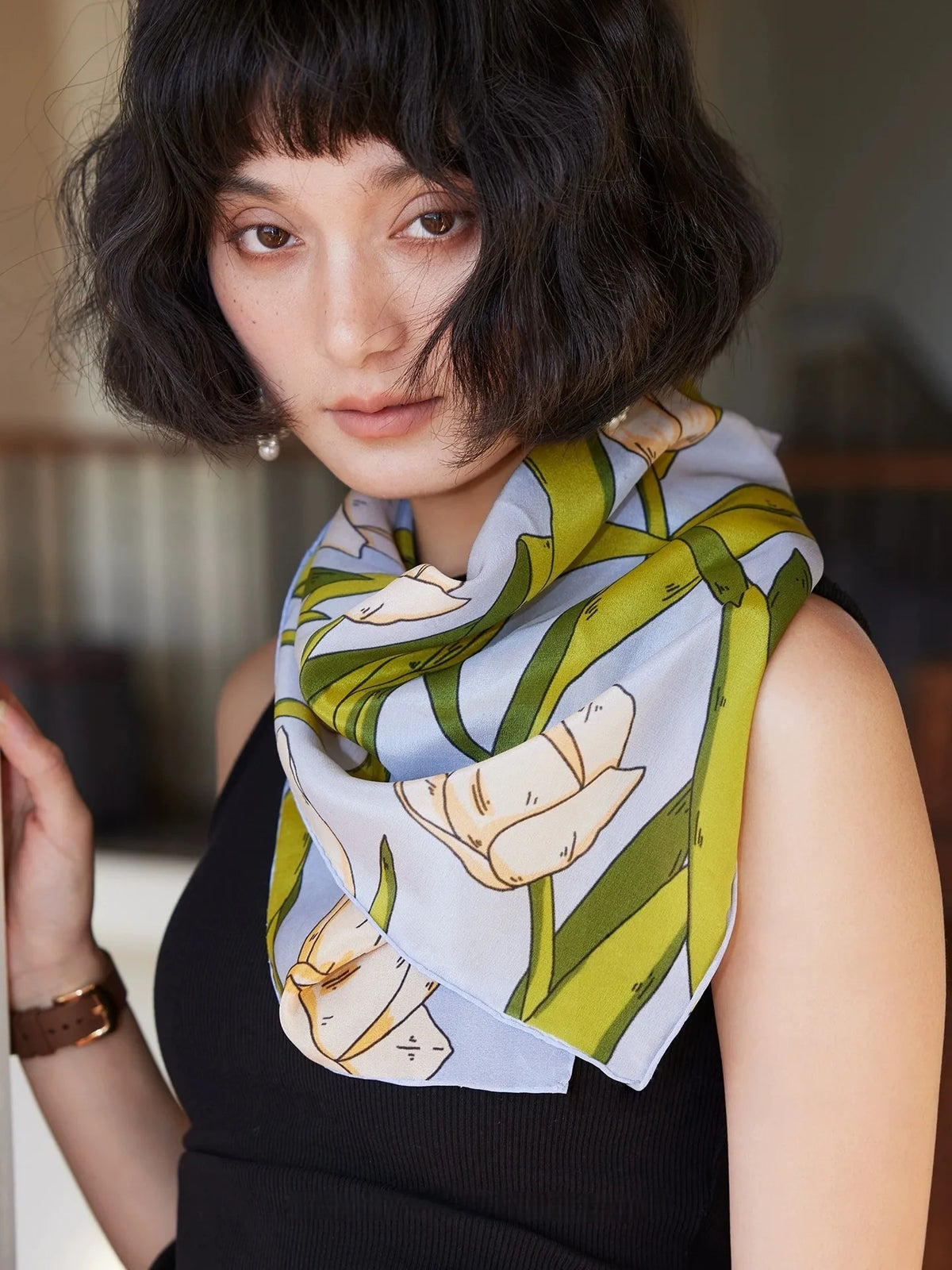 Blue tulip floral silk square scarf tied as an elegant neck scarf