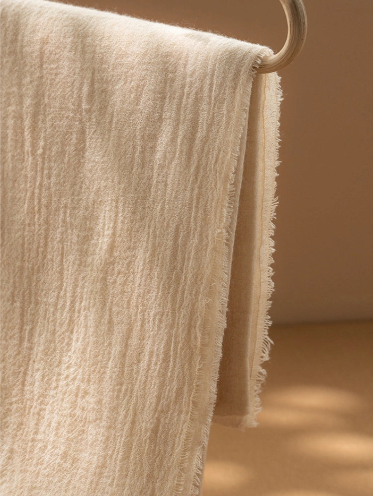 Champagne beige cashmere scarf, highlighting its breathable and soft cashmere fabric.