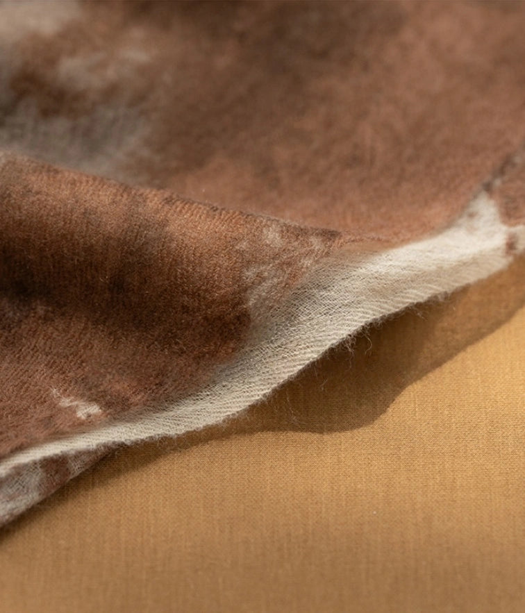 Detailed view of the coffee brown cashmere scarf, showcasing its luxurious and soft cashmere material.