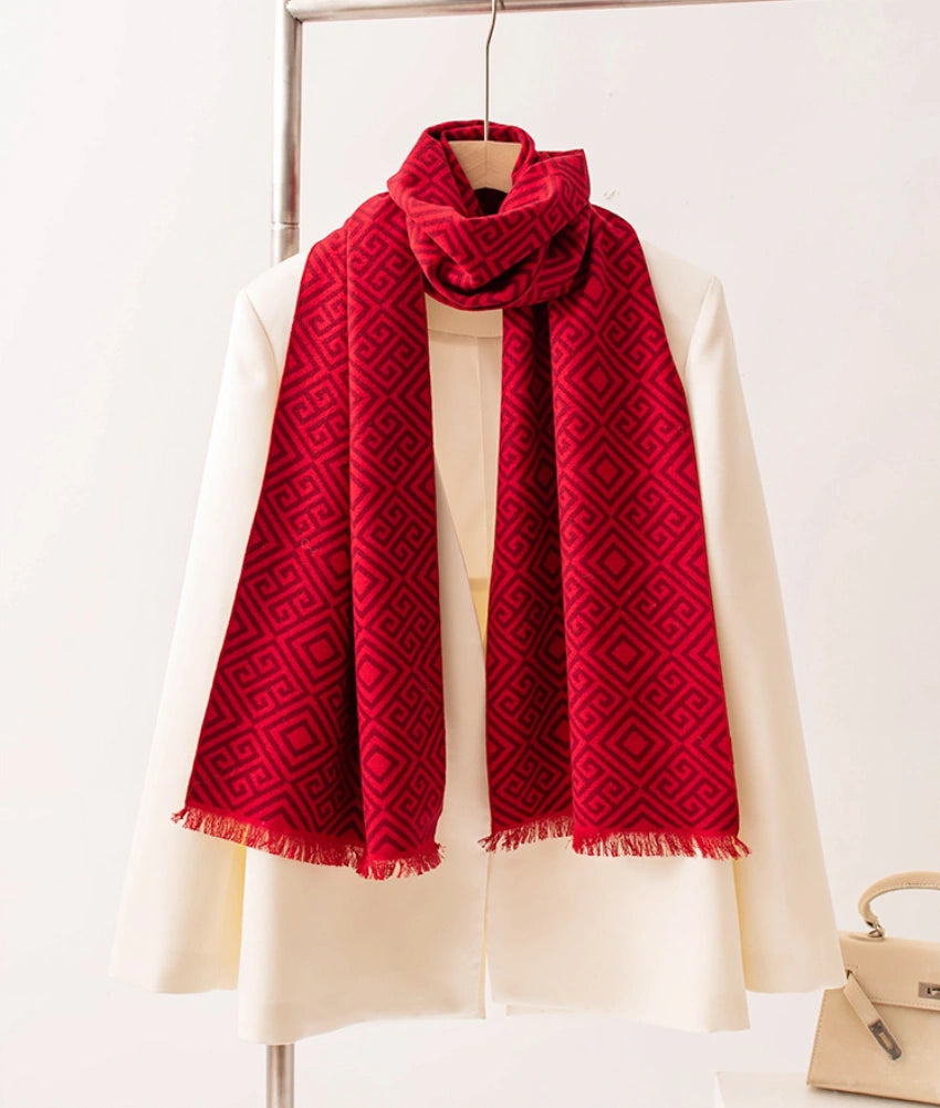 Elegant red brushed silk long scarf worn over a white blouse for winter styling