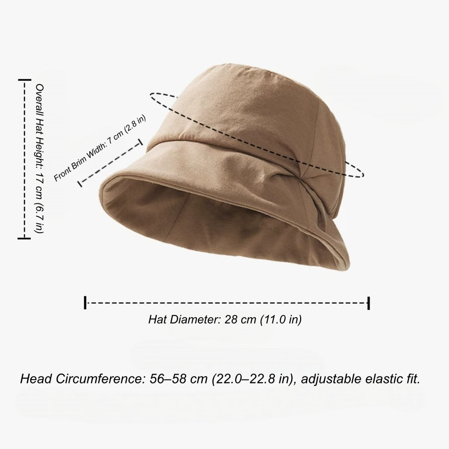 Pleated bucket hat size guide showing 17 cm height, 28 cm diameter, 7 cm front brim and adjustable 56–58 cm fit