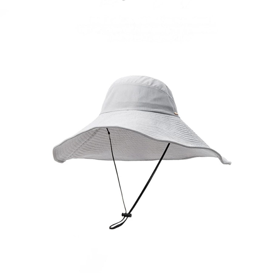 Blue gray foldable wide brim sun hat with adjustable chin strap and packable travel design
