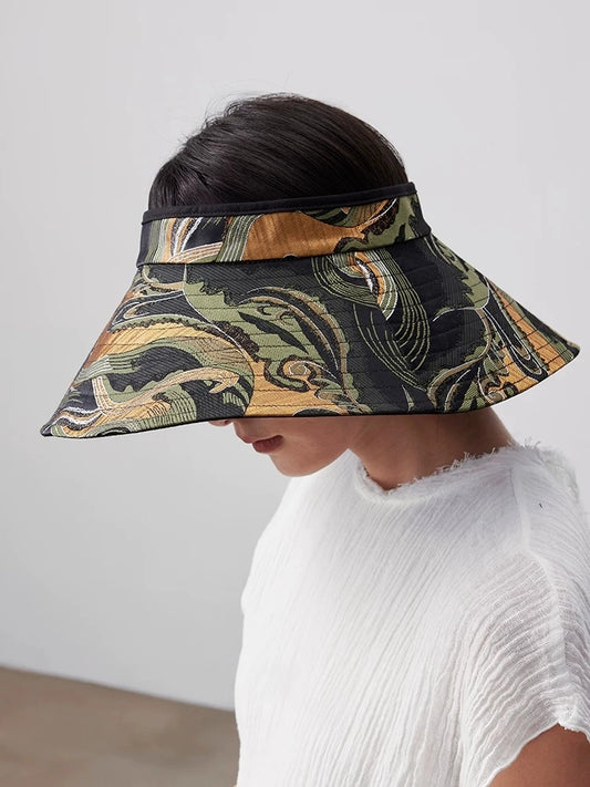 Close front view of vintage pattern wide brim sun visor hat with jacquard fabric and face-shading brim.