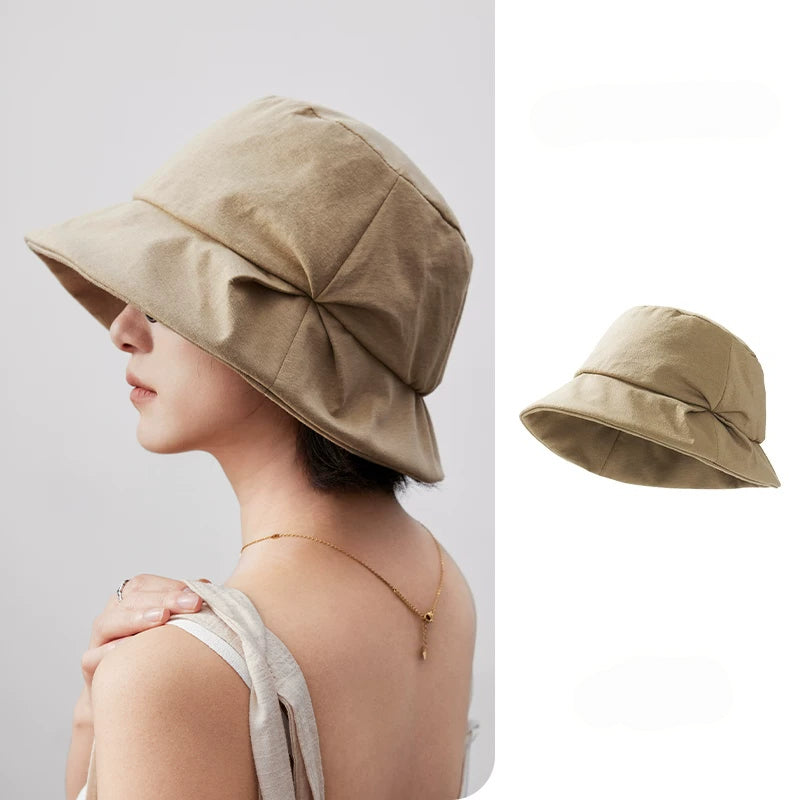 Light khaki artistic pleated bucket hat with folded brim, shown from the side with a separate product view