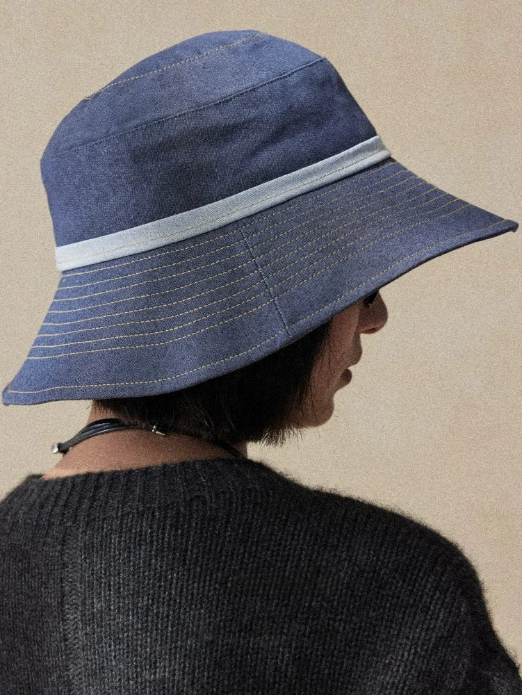 Back view of mist blue UV protection sun hat with wide brim and elegant travel-ready design
