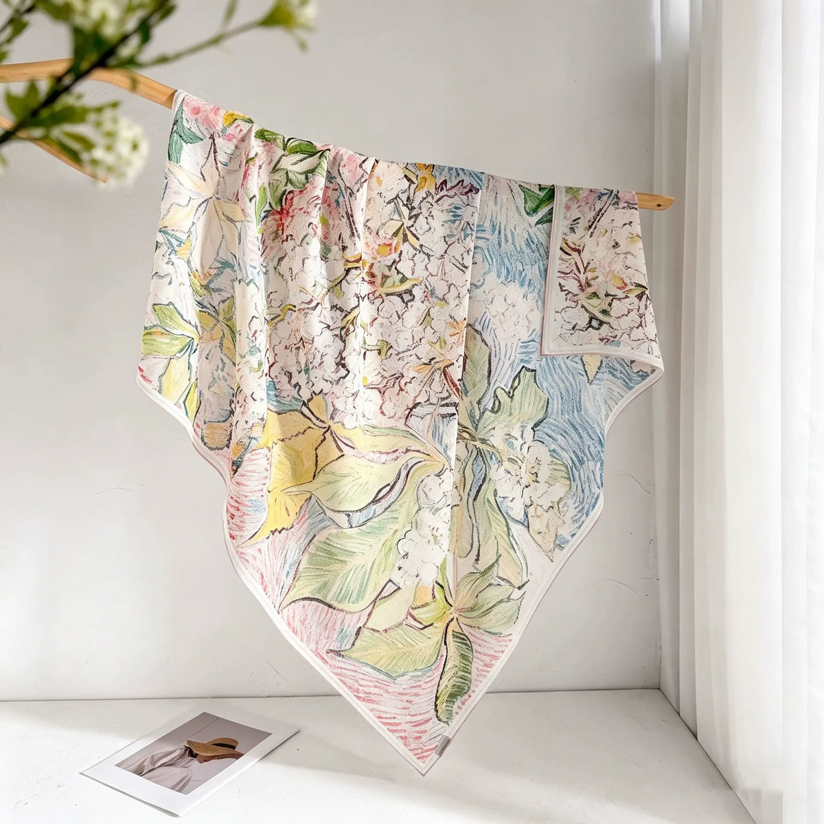 Monet-inspired floral mulberry silk square scarf displayed open with a soft pastel watercolor print