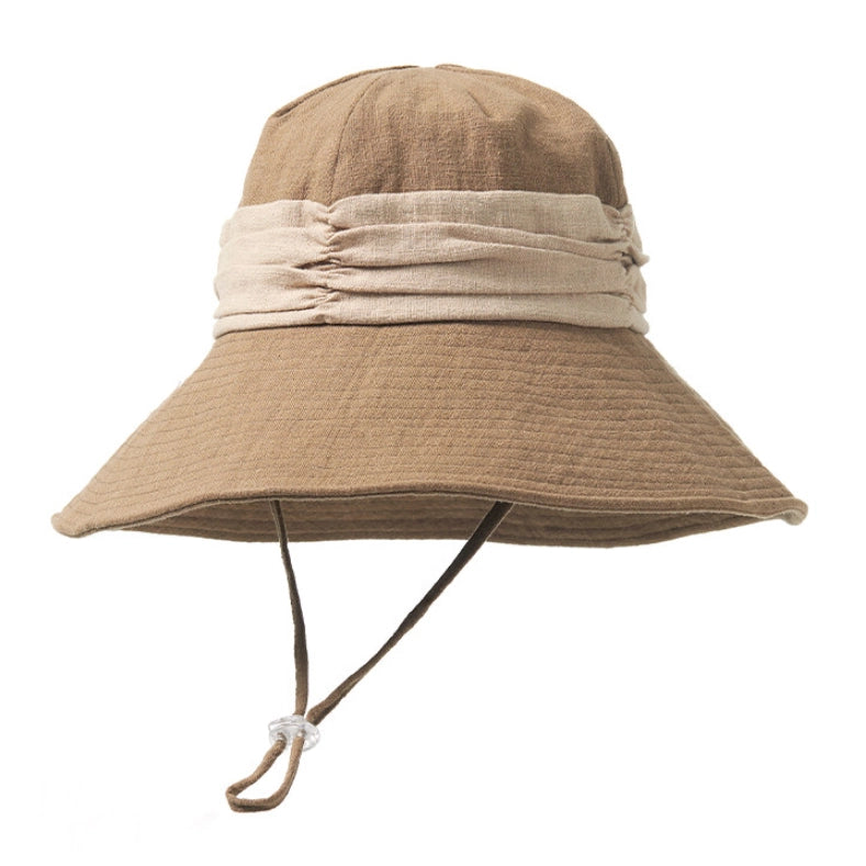 Khaki natural ramie bucket hat with wide brim, contrast band, and adjustable wind cord for outdoor summer wear.