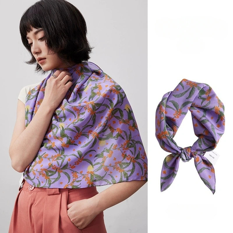 Elegant purple osmanthus print silk square scarf, made from 100% mulberry silk, showcases its vibrant floral design and smooth texture.