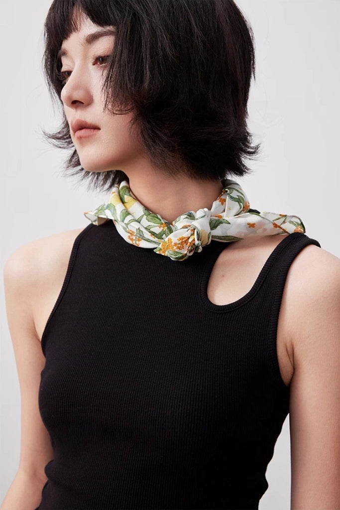 White osmanthus silk square scarf styled as a neck accessory, demonstrating its elegance and versatility.