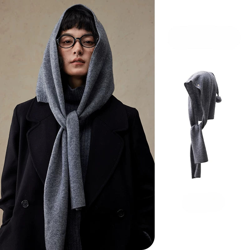 Women's dark grey wool hooded scarf styled with a black coat, with product detail view