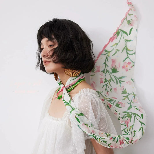 Woman wearing a lightweight mulberry silk scarf for elegant summer styling