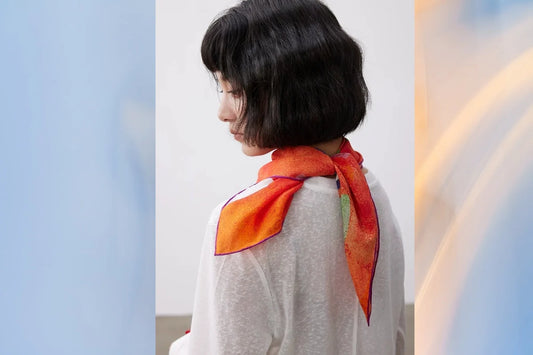 woman wearing silk scarf around neck summer styling elegant look