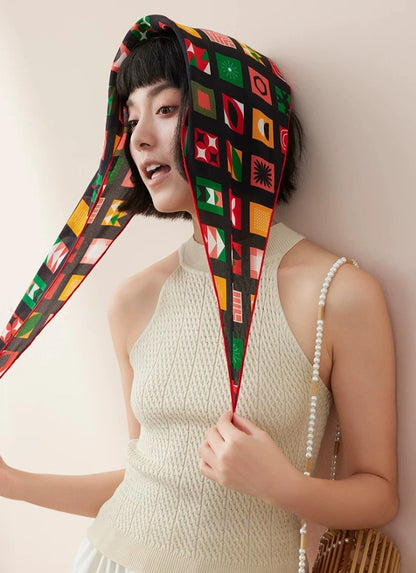 Mulberry silk triangle head scarf worn on model, retro geometric silk styling