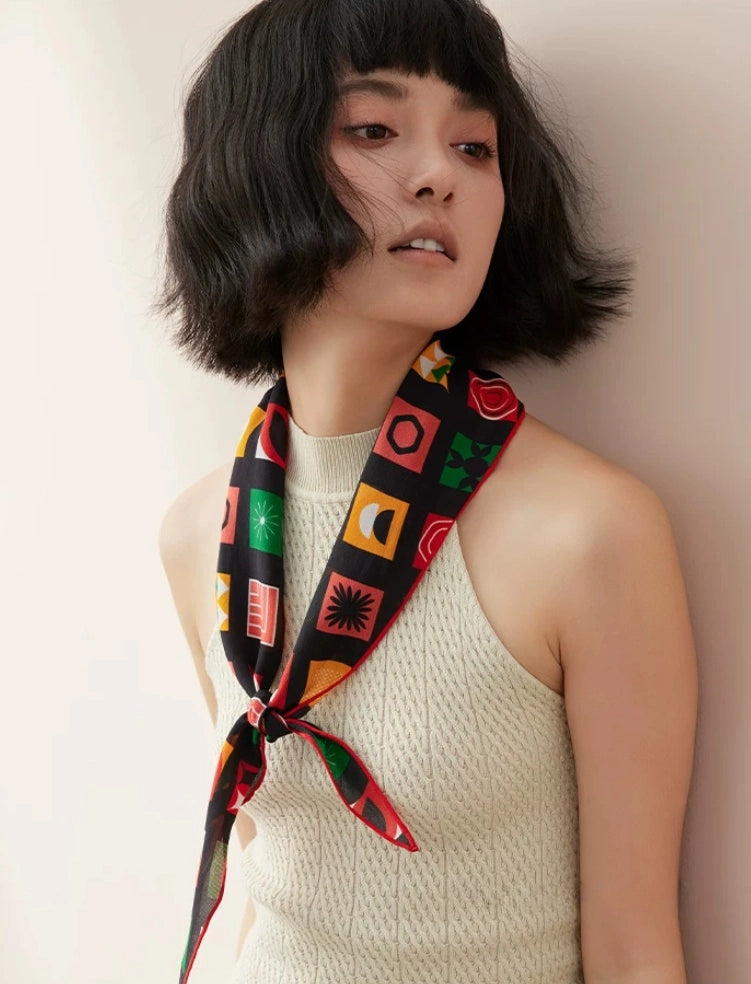 Geometric silk neck scarf worn on model, elegant vintage mulberry silk accessory