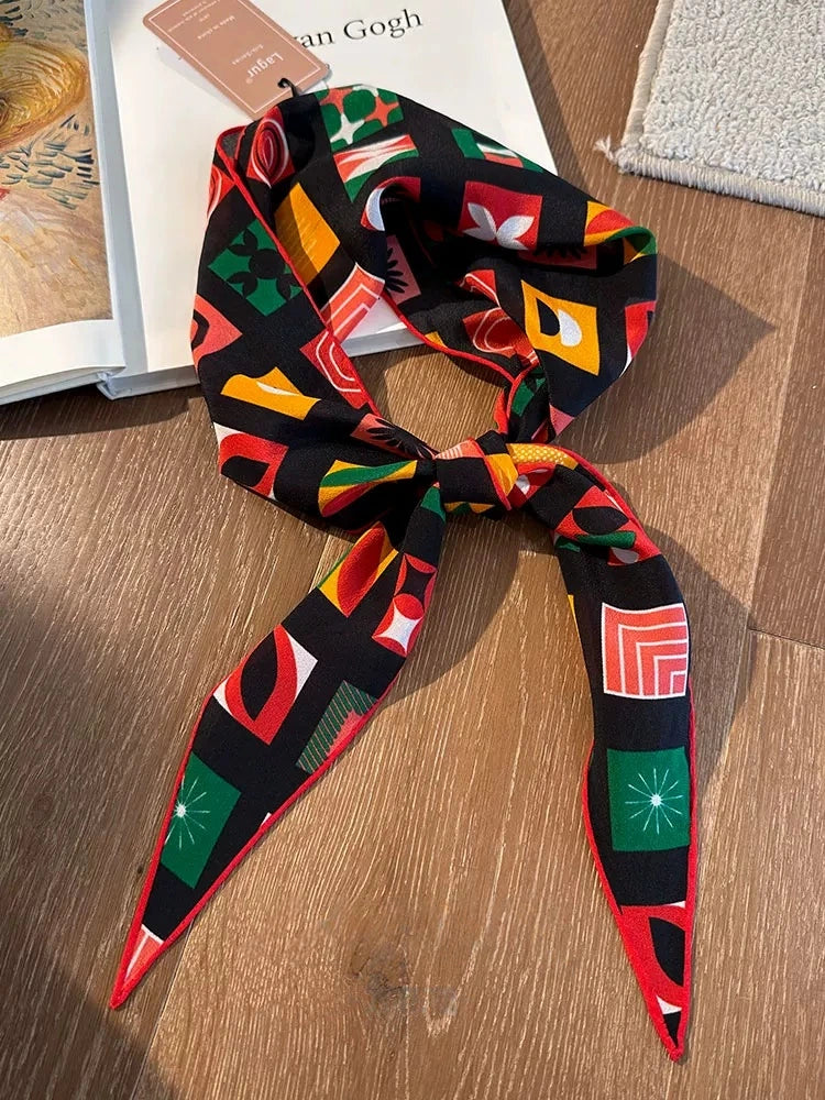 Mulberry silk geometric triangle scarf laid flat, colorful vintage print detail view