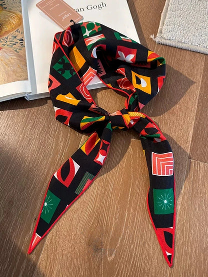 Mulberry silk geometric triangle scarf laid flat, colorful vintage print detail view