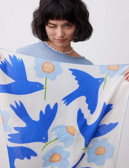 Blue bird flower print silk square scarf displayed open to show the artistic pattern