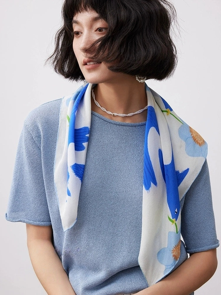 Blue bird flower silk square scarf draped over the shoulders for casual styling
