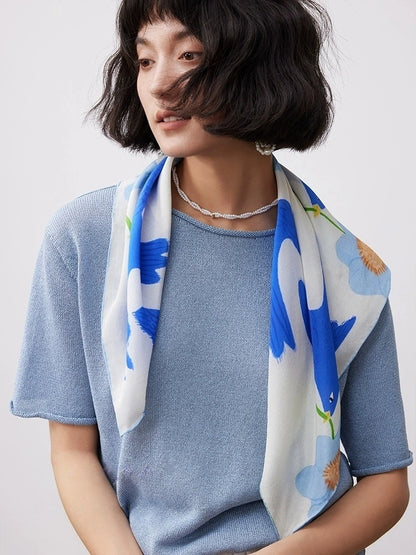 Blue bird flower silk square scarf draped over the shoulders for casual styling