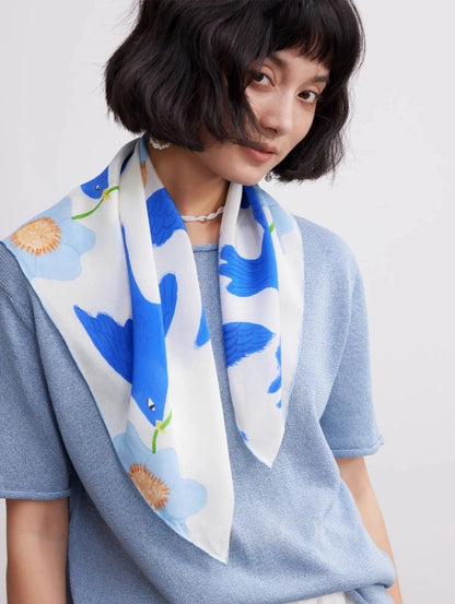 Blue bird flower mulberry silk scarf styled with a light blue outfit