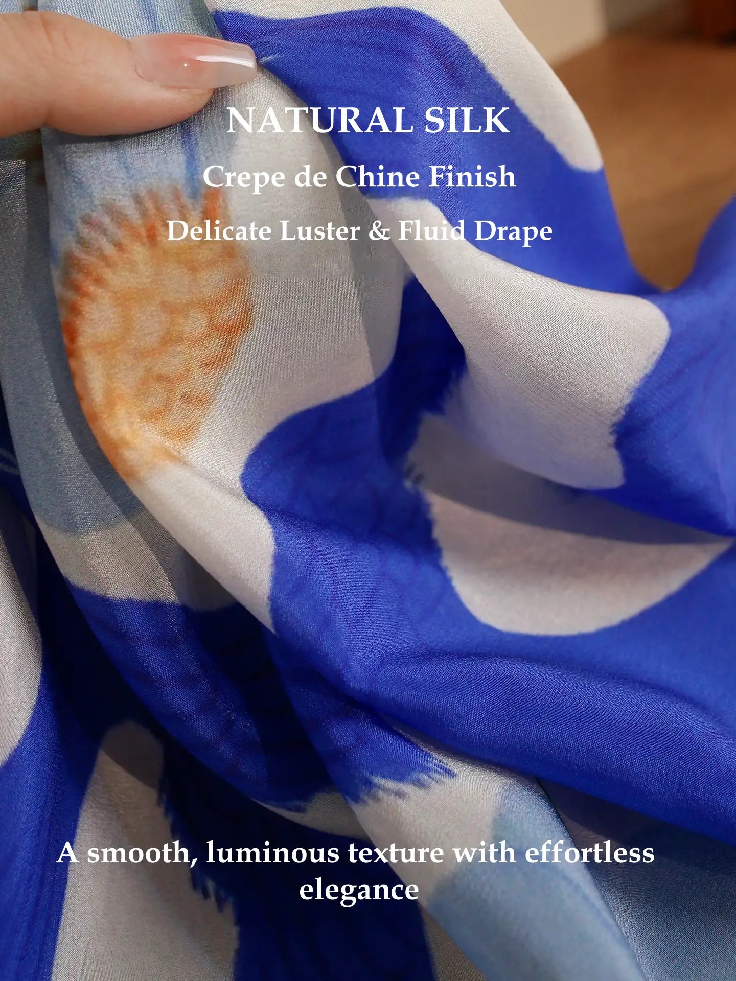 Close-up of blue bird flower silk scarf showing smooth texture and luminous sheen