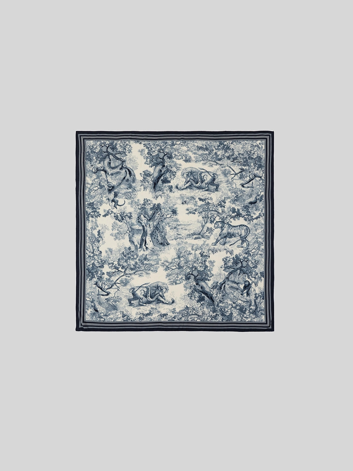 Luxurious blue silk wool scarf, 130 x 130 cm, displays a distinctive animal jungle print when laid flat—the perfect choice for elegant winter style.