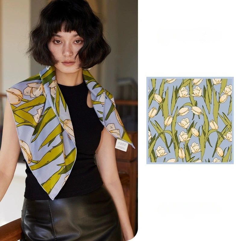 Blue tulip floral mulberry silk square scarf styled around the neck with matching flat lay detail