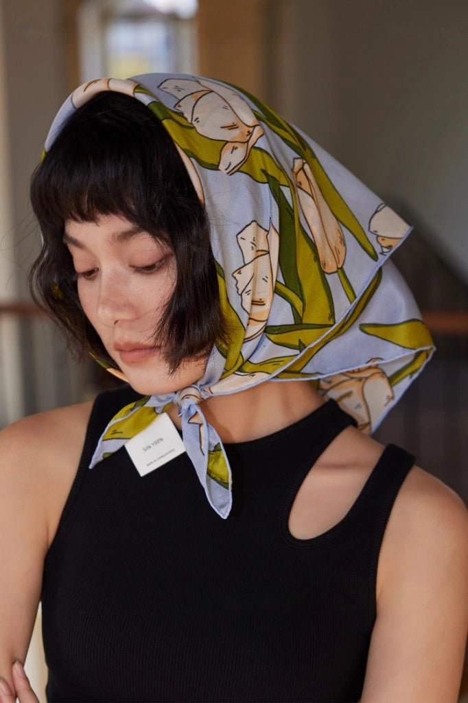 Blue tulip floral silk scarf worn as a head wrap for refined styling