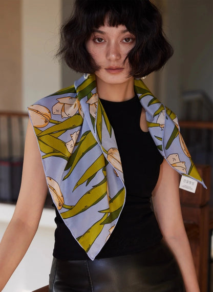 Blue tulip floral silk square scarf draped over the shoulders