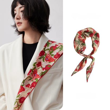 Blush pink pomegranate butterfly triangle silk scarf styled over a white blazer