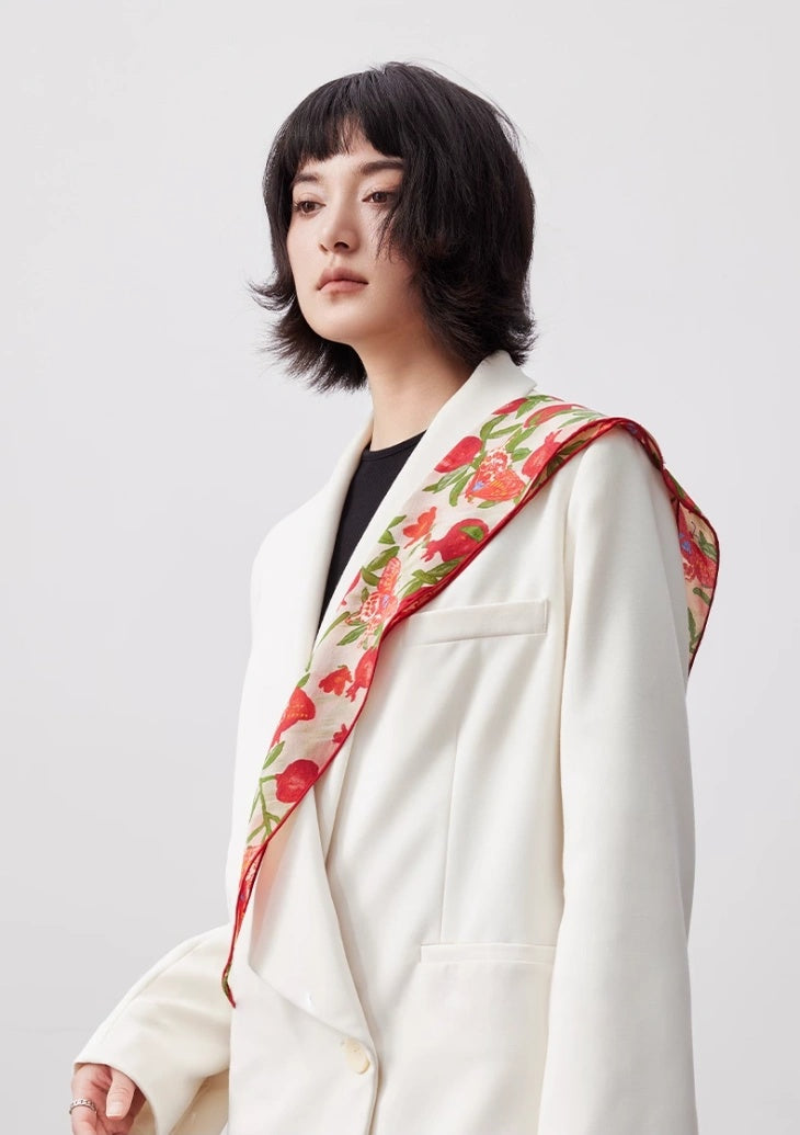 Elegant blush pink triangle silk scarf styled across the shoulder with a white outfit