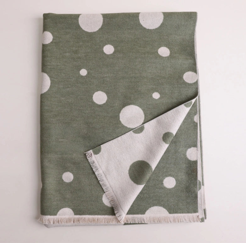 Folded olive green mulberry silk scarf with white polka dot print and soft brushed texture