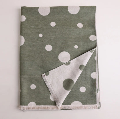 Folded olive green mulberry silk scarf with white polka dot print and soft brushed texture