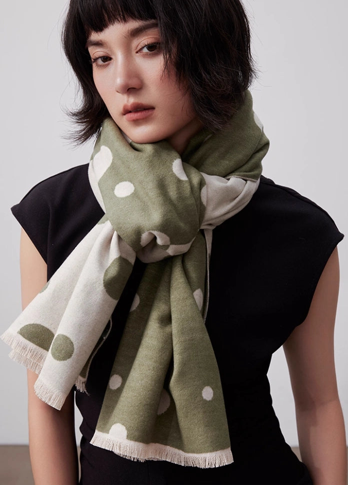 Olive green large brushed silk scarf worn as a soft neck wrap with white polka dot pattern