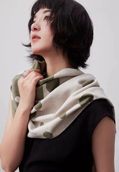 Model wearing an olive green mulberry silk scarf with brushed texture as an elegant shoulder wrap