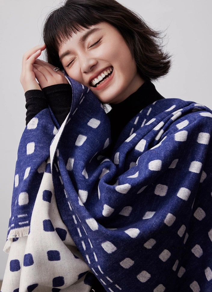 Model wrapped in a navy blue brushed silk shawl with soft cashmere-like texture for winter styling