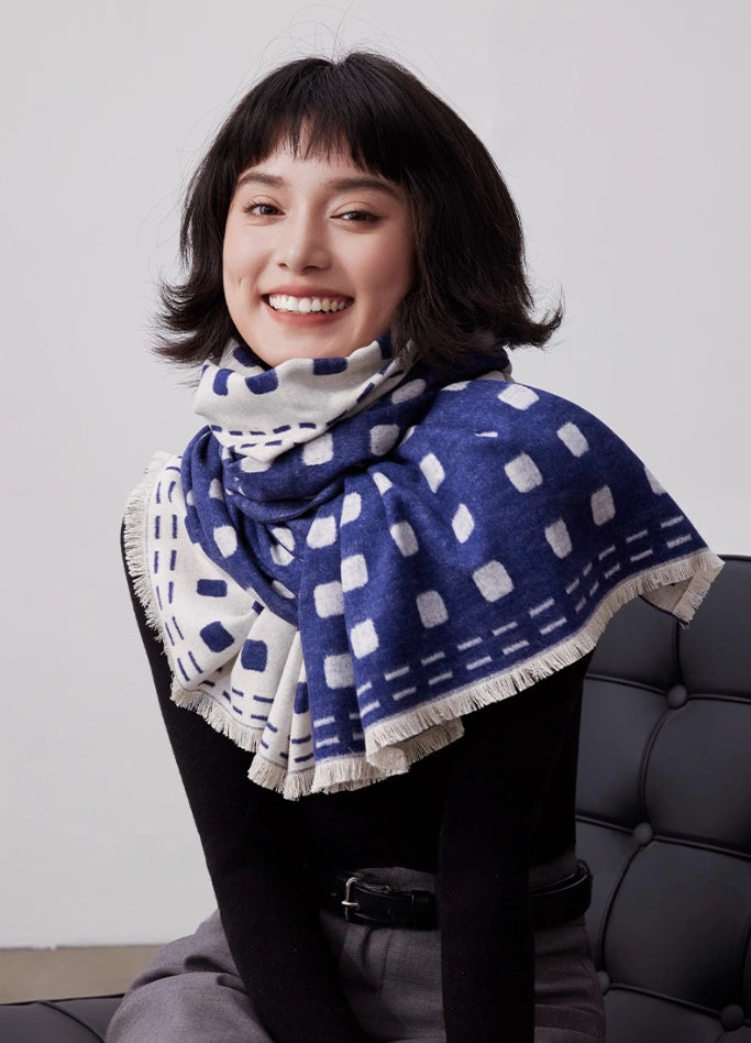 Navy blue brushed silk scarf styled as a cozy neck wrap with soft cashmere-like texture