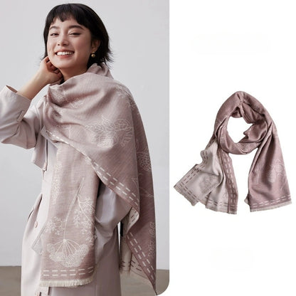 Soft pink mulberry silk scarf with brushed texture worn as a cozy neck wrap for women