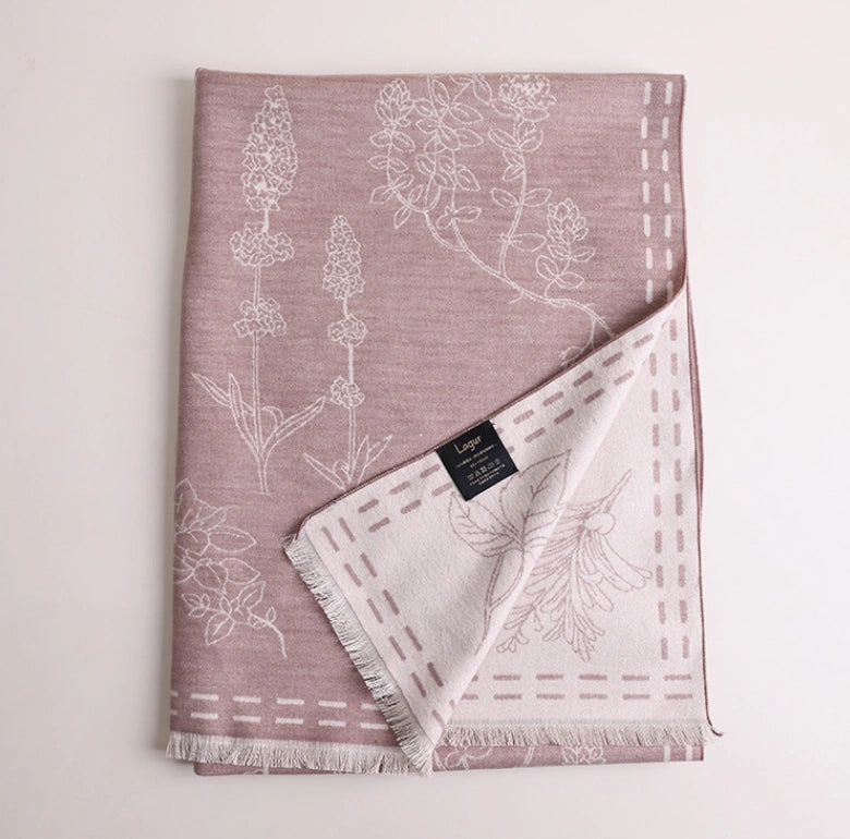 Folded pale pink mulberry silk scarf with white floral line art print and brushed silk finish