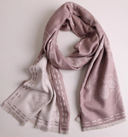 Pale pink large brushed silk scarf displayed in a soft draped shape with delicate floral pattern