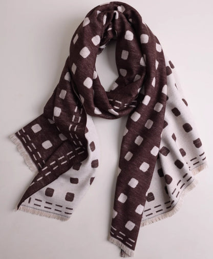 Brown brushed silk scarf displayed in a soft draped shape with ivory geometric print and cashmere-like texture