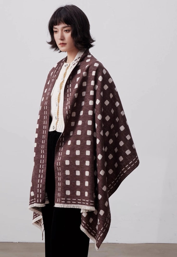 Brown and ivory large brushed silk scarf worn as an oversized shawl with elegant geometric dot pattern