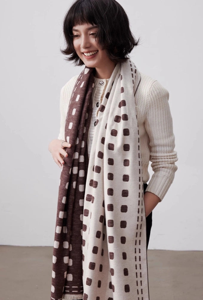 Model wearing a brown and ivory brushed silk scarf as a long soft neck wrap for winter styling