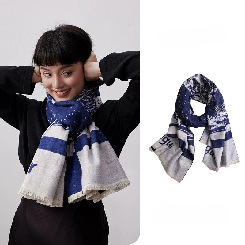 Blue and ivory brushed silk scarf styled around the neck with an elegant geometric pattern