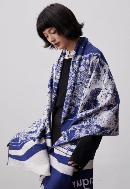 Blue and ivory mulberry silk scarf draped over the shoulders with a soft brushed finish