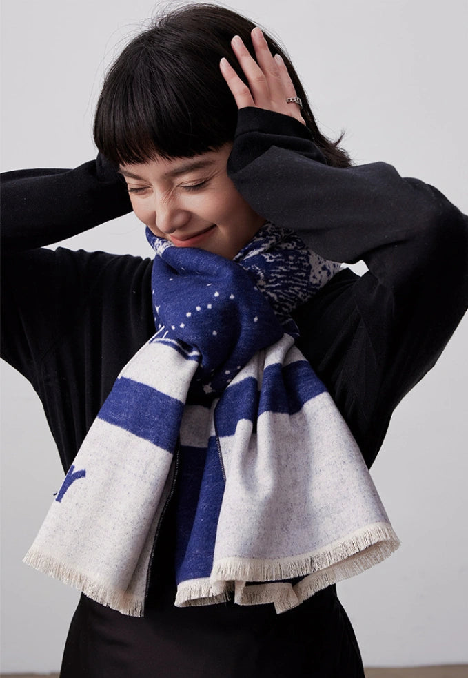 Blue large mulberry silk scarf styled as a cozy neck wrap with artistic print for winter wear