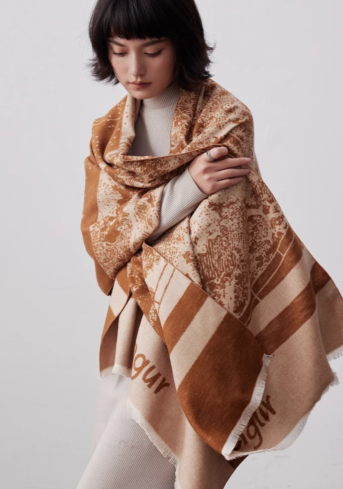 Model wearing a brown large brushed silk wrap over the shoulders for elegant winter styling