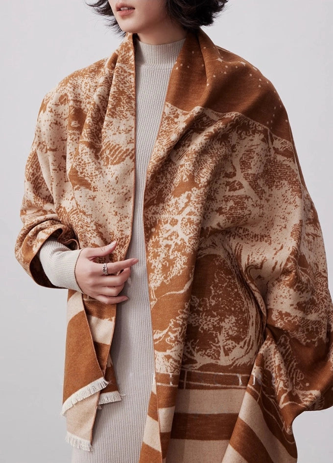 Brown artistic brushed silk wrap for women styled over a neutral outfit as an elegant winter silk scarf
