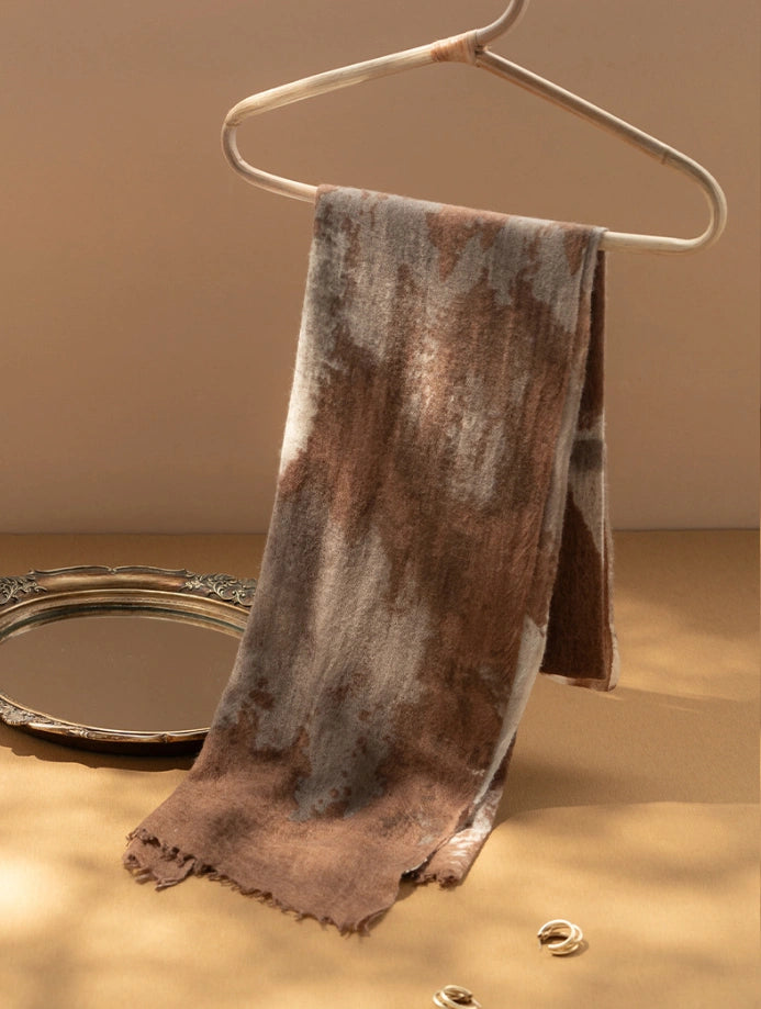 Coffee brown cashmere scarf draped elegantly, emphasizing its lightweight and oversized dimensions.